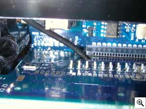 A picture of the how the antenna cable routes through the small
opening that is designed to the left drive and fan assembly slot.